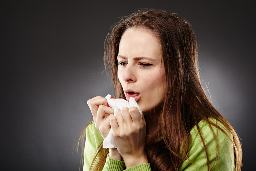 Woman with flu coughing
