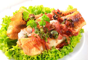 Pan fried fish fillets with bacon bits