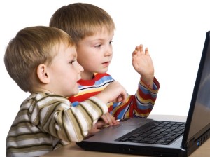 Two brothers play computer games