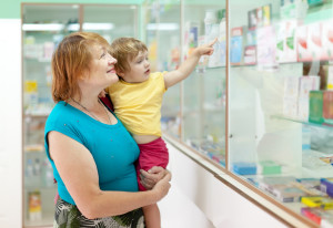 Mature woman with child at pharmacy
